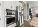 Sleek stainless steel refrigerator and oven appliances stand out in this modern kitchen at 10080 E 160Th Pl, Brighton, CO 80602
