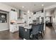 Modern kitchen featuring white cabinets, stainless steel appliances, and granite countertops at 10080 E 160Th Pl, Brighton, CO 80602