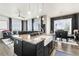 Bright kitchen with granite countertops, stainless steel appliances, and an island with seating at 10080 E 160Th Pl, Brighton, CO 80602
