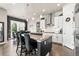 Kitchen featuring a granite island with seating and a stainless steel hood at 10080 E 160Th Pl, Brighton, CO 80602