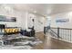 Elegant living room featuring hardwood floors, stylish furnishings, and an abundance of natural light at 10080 E 160Th Pl, Brighton, CO 80602