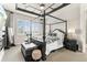 Luxurious main bedroom with a decorative ceiling, a four-poster bed, and natural light at 10080 E 160Th Pl, Brighton, CO 80602