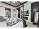 Sophisticated main bedroom with a fireplace, television, and statement lighting at 10080 E 160Th Pl, Brighton, CO 80602