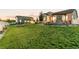 Expansive lawn with outdoor features offers ample space for recreation and entertaining at 10080 E 160Th Pl, Brighton, CO 80602
