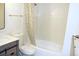 Clean bathroom with a tiled shower-tub combination and stylish vanity at 922 S Walden St # 101, Aurora, CO 80017