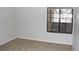 Bright bedroom with neutral carpet and a large window for natural light at 922 S Walden St # 101, Aurora, CO 80017
