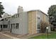 Exterior shot of condo features well-maintained landscaping and stone accents at 922 S Walden St # 101, Aurora, CO 80017