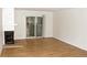 Living room featuring wood flooring, a fireplace, and sliding glass doors to a private patio at 922 S Walden St # 101, Aurora, CO 80017