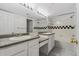 Bright bathroom features double sinks, granite countertops and a shower-tub combo at 1631 Egret Way, Superior, CO 80027