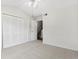Bright bedroom featuring neutral carpet, a ceiling fan, vaulted ceilings, and a large closet at 1631 Egret Way, Superior, CO 80027