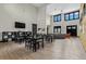 Open common room features high ceilings, lots of windows, hardwood floors, and contemporary furniture at 1631 Egret Way, Superior, CO 80027