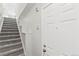 Bright entryway with carpeted stairs and white walls offering a welcoming ambiance at 1631 Egret Way, Superior, CO 80027