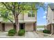 Inviting townhome featuring a private garage, well-maintained landscaping, and proximity to a tranquil lake at 1631 Egret Way, Superior, CO 80027