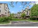 Beautiful exterior view of the townhome community with manicured lawn and reserved parking spots at 1631 Egret Way, Superior, CO 80027