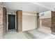 Attached garage with direct access to the home's entry, featuring brick accents and a convenient layout at 1631 Egret Way, Superior, CO 80027