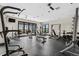 Brightly lit gym features a variety of workout equipment and several windows overlooking the outside at 1631 Egret Way, Superior, CO 80027