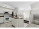 Bright kitchen featuring an island, stainless steel appliances, and easy access to additional living spaces at 1631 Egret Way, Superior, CO 80027