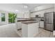 Modern kitchen with stainless steel appliances, island, granite countertops, and an open-concept design at 1631 Egret Way, Superior, CO 80027