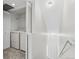 Convenient laundry room featuring a stackable washer and dryer and built in shelving at 1631 Egret Way, Superior, CO 80027