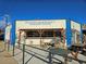 Exterior view of Huckleberry Roasters building, featuring outdoor seating and colorful mural art at 4219 Pecos St, Denver, CO 80211