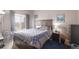 Comfortable bedroom with a large window and plenty of natural light at 8707 E Florida Ave # 410, Denver, CO 80247