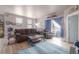 Cozy living room with comfortable seating, access to a patio, and lots of natural light at 8707 E Florida Ave # 410, Denver, CO 80247