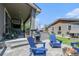 Backyard patio area features a grill, outdoor seating, fireplace, and lush green lawn at 4180 Ames St, Denver, CO 80212