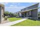 Beautifully landscaped backyard with a lush lawn, patio, and outdoor living at 4180 Ames St, Denver, CO 80212