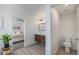 Modern bathroom boasting wood-look floors, floating vanity and easy access to the bedroom and toilet at 4180 Ames St, Denver, CO 80212