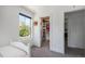 Bedroom with walk-in closet and window overlooking outdoor view at 4180 Ames St, Denver, CO 80212
