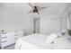 Bedroom showing modern ceiling fan and sliding closet doors at 4180 Ames St, Denver, CO 80212