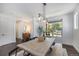Charming dining room with a bench seat and a view of the front yard, creating a warm and inviting atmosphere at 4180 Ames St, Denver, CO 80212