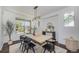 Inviting dining room with large windows and stylish decor, offering a bright and airy space at 4180 Ames St, Denver, CO 80212
