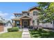 Charming two-story home with landscaped yard and inviting front porch with wood accents at 4180 Ames St, Denver, CO 80212