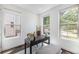 Bright office space with three windows, a desk, and bench at 4180 Ames St, Denver, CO 80212