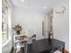 Bright office space featuring built-in shelving, hardwood floors, and natural light from a large window at 4180 Ames St, Denver, CO 80212