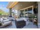 Outdoor patio featuring a seating area with comfortable chairs and a sliding glass doors with outdoor living at 4180 Ames St, Denver, CO 80212