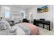 Cozy bedroom with a work desk, TV and large window providing natural light at 9742 Fairwood St, Littleton, CO 80125