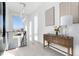 Bright hallway with lots of natural light and a stylish console table at 9742 Fairwood St, Littleton, CO 80125