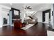 Open-concept living room with modern fireplace, floating shelves and a staircase with stainless steel banisters at 9742 Fairwood St, Littleton, CO 80125