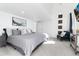 Bright main bedroom with a large comfortable bed, accent chair, and stylish decor at 9742 Fairwood St, Littleton, CO 80125