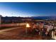 Rooftop deck featuring a modern fire pit and lounge chairs, perfect for outdoor relaxation with city views at 9742 Fairwood St, Littleton, CO 80125