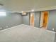 Spacious finished basement with carpet and easy access to other areas at 2561 W Dartmouth Ave, Denver, CO 80236