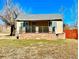 Charming single-story home featuring a quaint porch and brick accents at 2561 W Dartmouth Ave, Denver, CO 80236