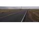 Property located on a quiet paved road with open fields nearby at 47855 E 88Th Ave, Bennett, CO 80102