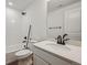 Bright bathroom features shower-tub combo, white vanity and wood-style floors at 24708 E 40Th Ave, Aurora, CO 80019