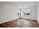 Bright and airy bedroom with hardwood floors and two large windows offering neighborhood views at 24708 E 40Th Ave, Aurora, CO 80019