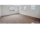 Bright bedroom with plush carpet and lots of natural light from the large windows at 24708 E 40Th Ave, Aurora, CO 80019