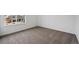 Neutral carpet and white walls in a bedroom with a large window at 24708 E 40Th Ave, Aurora, CO 80019