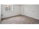 Bedroom with neutral carpet, white walls, window and closet at 24708 E 40Th Ave, Aurora, CO 80019